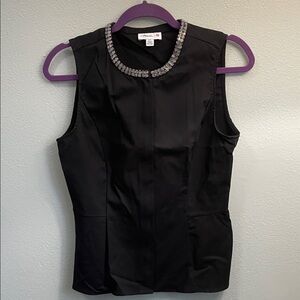 Elegant Black Sleeveless Top with Embellished Neckline